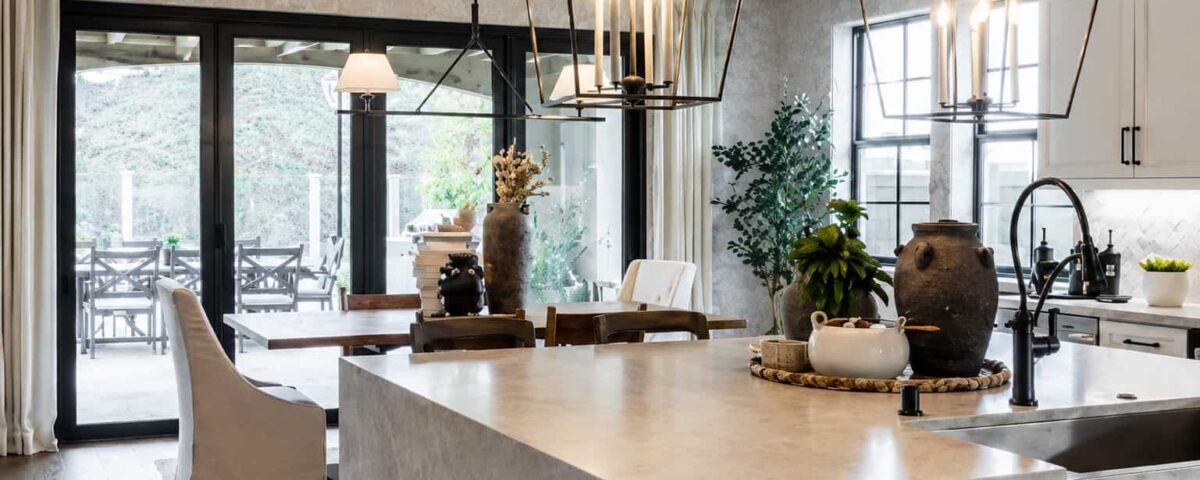 Modern kitchen interior with large glass sliding doors enhancing natural light for Ontario, CA window replacement