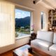 Vertical blinds framing Ontario, CA window replacement with scenic outdoor view