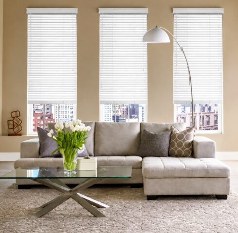 Modern living room featuring bright Ontario, CA windows with white blinds