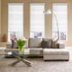 Modern living room featuring bright Ontario, CA windows with white blinds