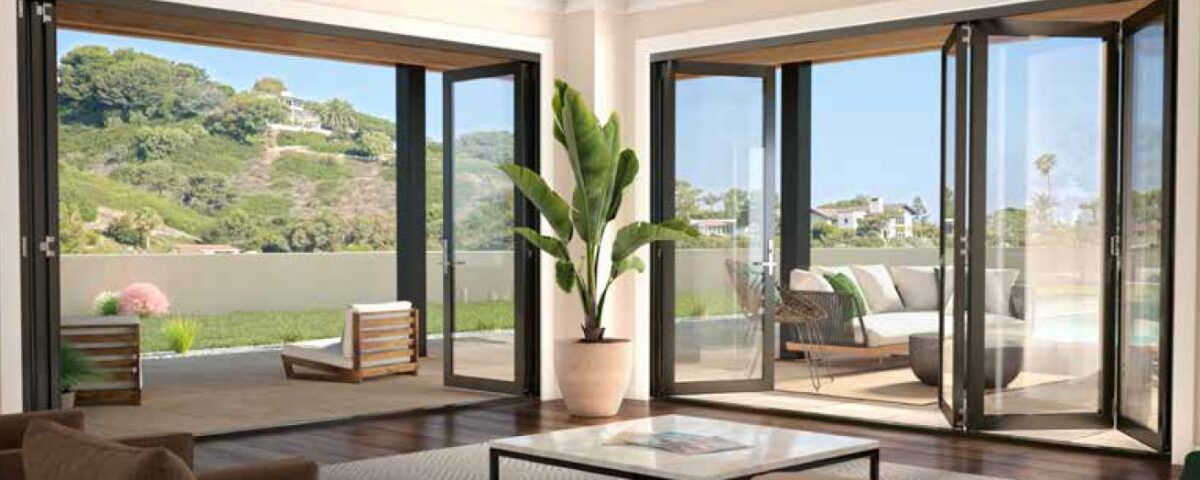 Folding patio doors with wide glass panels complement Ontario, CA windows in a modern home